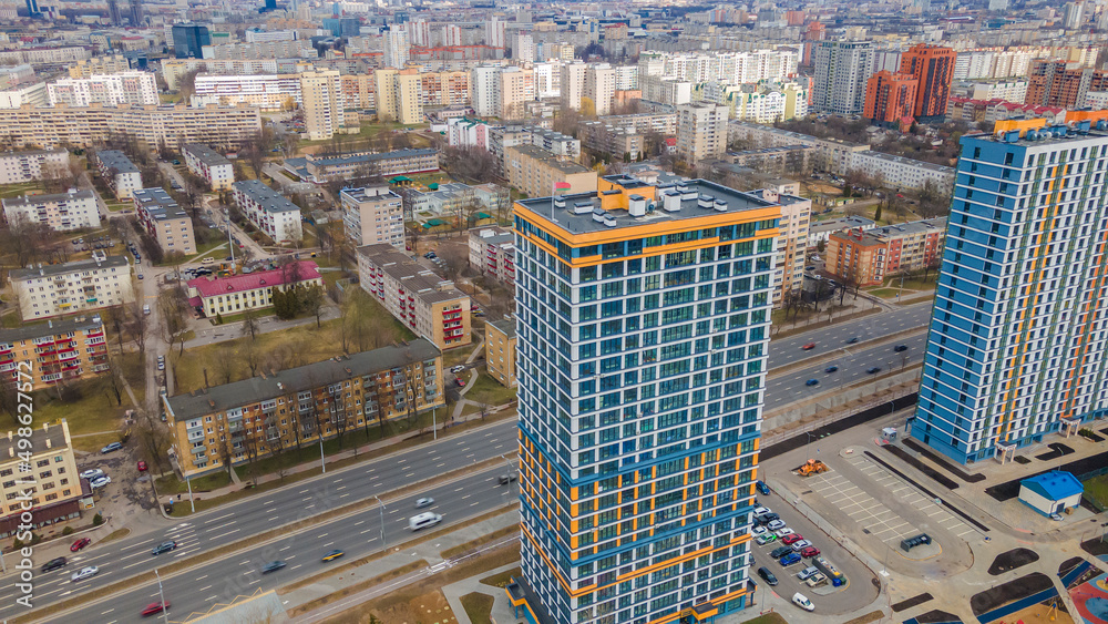 Fototapeta premium New multi-storey residential building apartment houses aerial view with children playground. City neighbourhood.