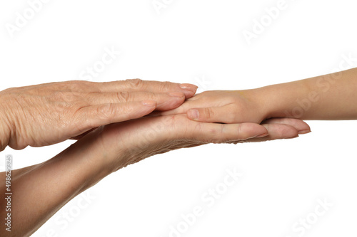 grandmothers hands with little girl hands isolated on white background