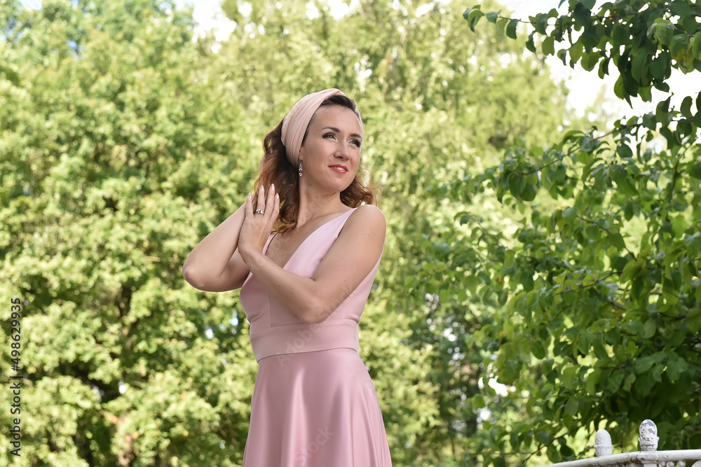beautiful elegant brunette woman in pink dress beautiful elegant brunette woman in pink dress