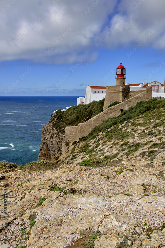 Lighthouse and cliffs at Cape Saint Vincent in Algarve, near Sagres, Portugal Lighthouse and cliffs at Cape Saint Vincent in Algarve, near Sagres, Portugal