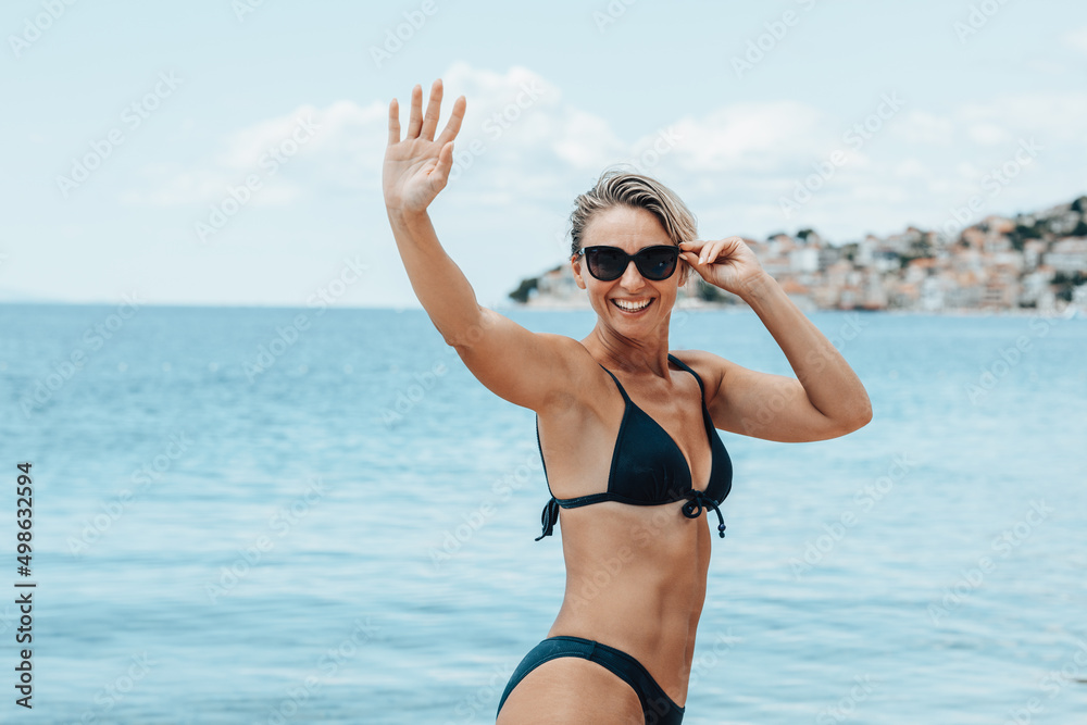 Woman Enjoying  And Having Fun At The Beach