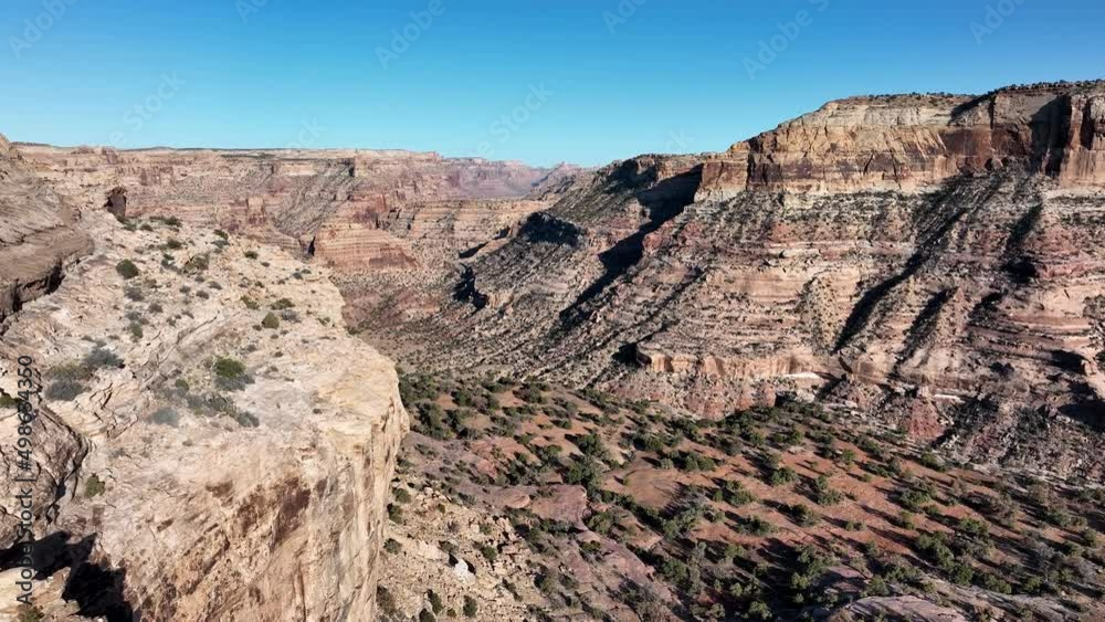 Flying through desert canyon in the Little Grand Canyon in Utah from the Wedge in San Rafael Swell. Flying through desert canyon in the Little Grand Canyon in Utah from the Wedge in San Rafael Swell.
