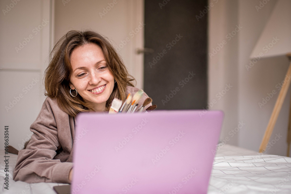 Smiling Painting Student with Teeth Braces Brackets and Brushes Ready to Take Her Online Class and Paint a Canvas in Her Room Smiling Painting Student with Teeth Braces Brackets and Brushes Ready to Take Her Online Class and Paint a Canvas in Her Room