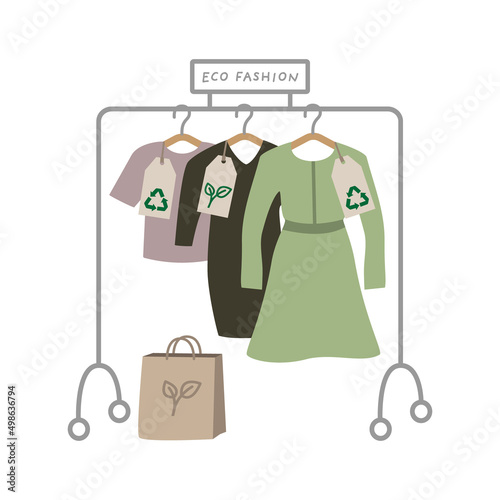 Sustainable fashion store. Ecological clothes hanging on rack. 