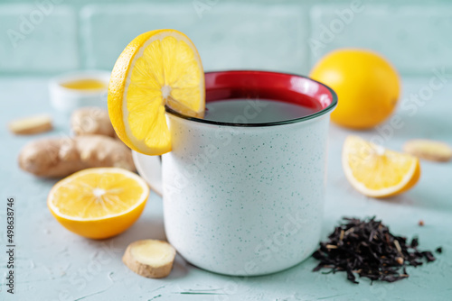 Cup of black tea with honey, lemon and ginger