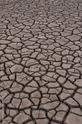 close up of dry cracked mud abstract pattern and shapes