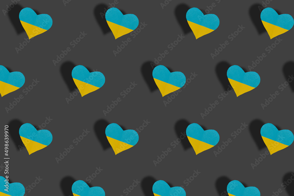 hearts in the color of Ukrainian flags pattern on a gray background, peace, no war hearts in the color of Ukrainian flags pattern on a gray background, peace, no war
