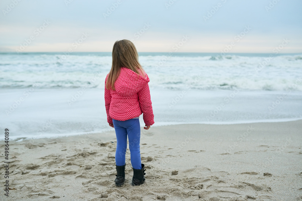 Theres so much beauty out there. Shot of a little girl at the beach.