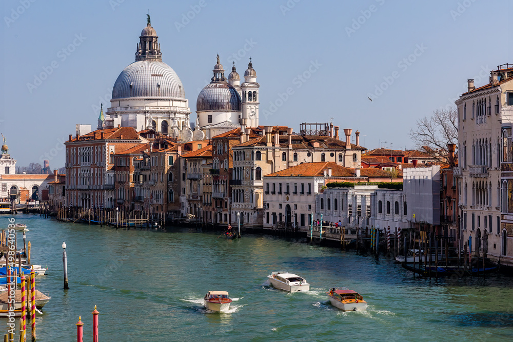 Boat traffic on the Grand Canal of Venice looking towards Salute from the Accademia area