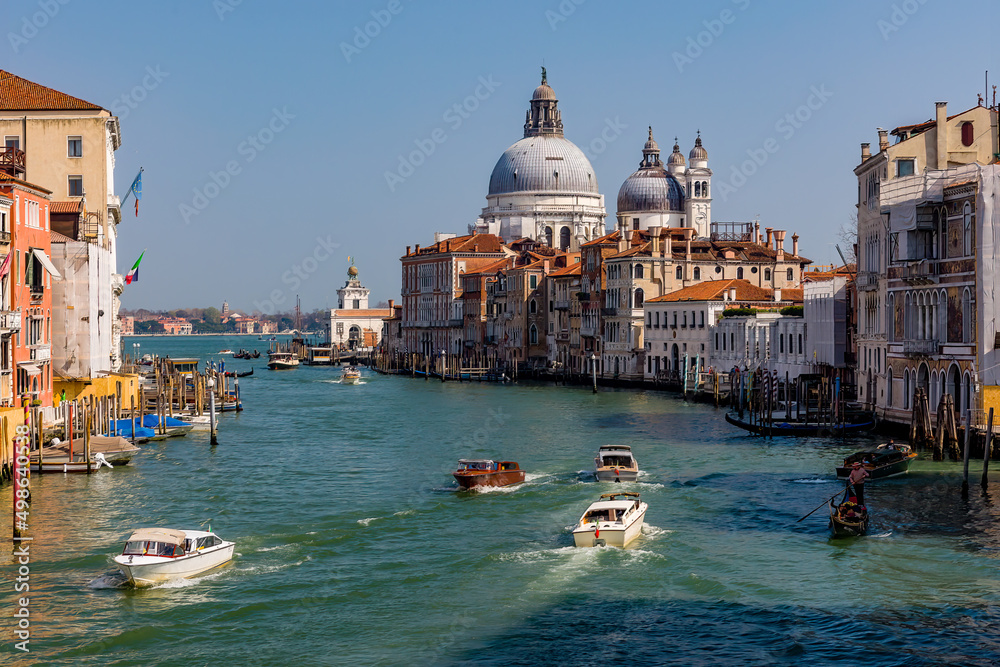 Boat traffic on the Grand Canal of Venice looking towards Salute from the Accademia area