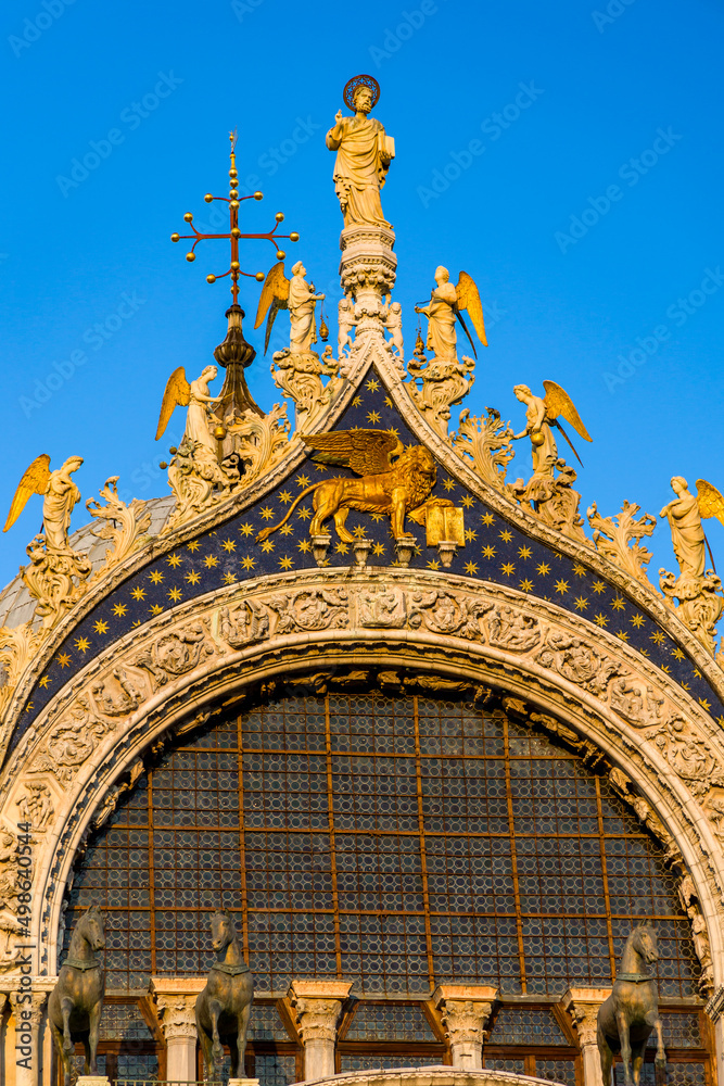 Ornate sculptures and decorations on the exterior of the ancient Basilica of St Marks in the city of Venice