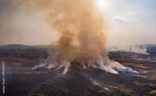 Canvas Print Aerial panoramic view of a large grassfire on moorland in Wales