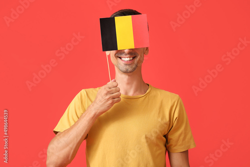 Young man with flag of Belg...