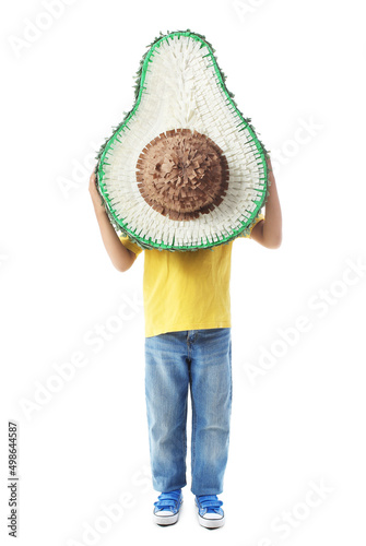 Child holding large avocado...
