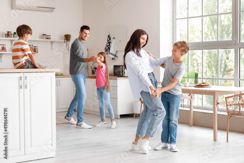 Happy  family dancing in ki...