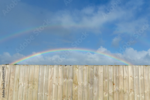 fence and rainbow