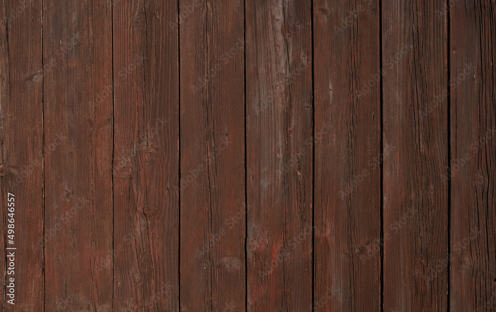 Natural Brown Wooden Background. Wooden rustic background. Old boards. Copy space for your text or image. Top view. Dark brown wood boards. Blank for design and require a wood grain. Vertical. Natural Brown Wooden Background. Wooden rustic background. Old boards. Copy space for your text or image. Top view. Dark brown wood boards. Blank for design and require a wood grain. Vertical.