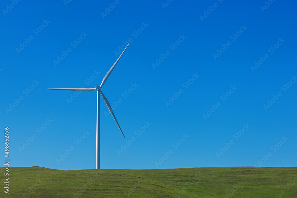 Electrical wind power mill over the blue sky. Electrical wind power mill over the blue sky.