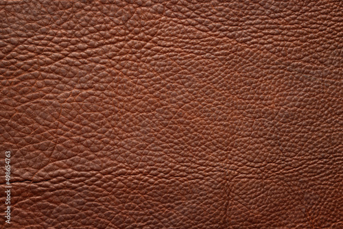 brown leather texture as background. natural cowhide close-up photo