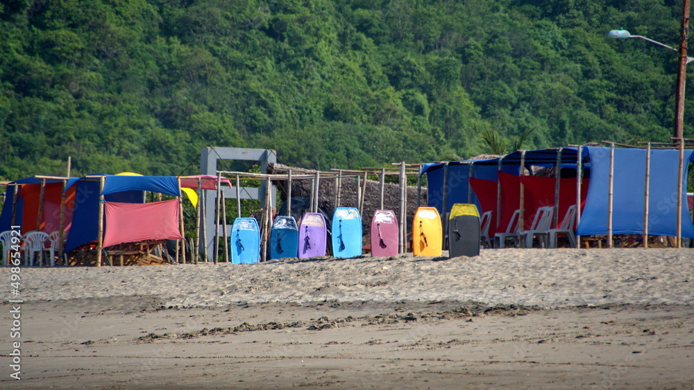 Body boards and shelters for rent on the beach, in Canoa, Ecuador Body boards and shelters for rent on the beach, in Canoa, Ecuador
