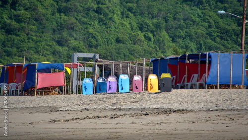 Body boards and shelters for rent on the beach, in Canoa, Ecuador