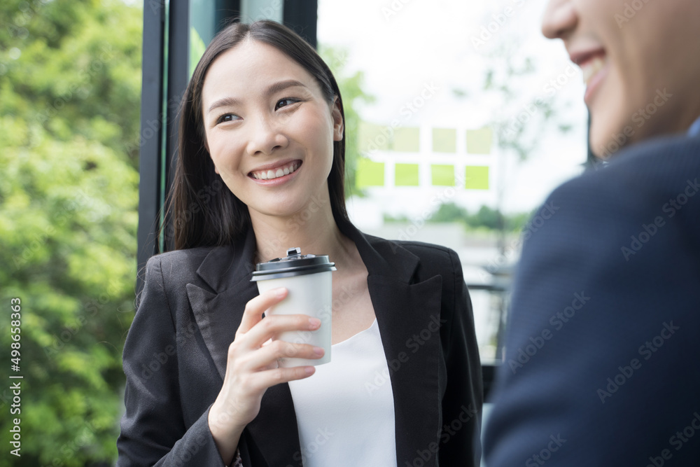 Portrait Asian businesswoman confidently while drink coffee in break time at office. Portrait Asian businesswoman confidently while drink coffee in break time at office.