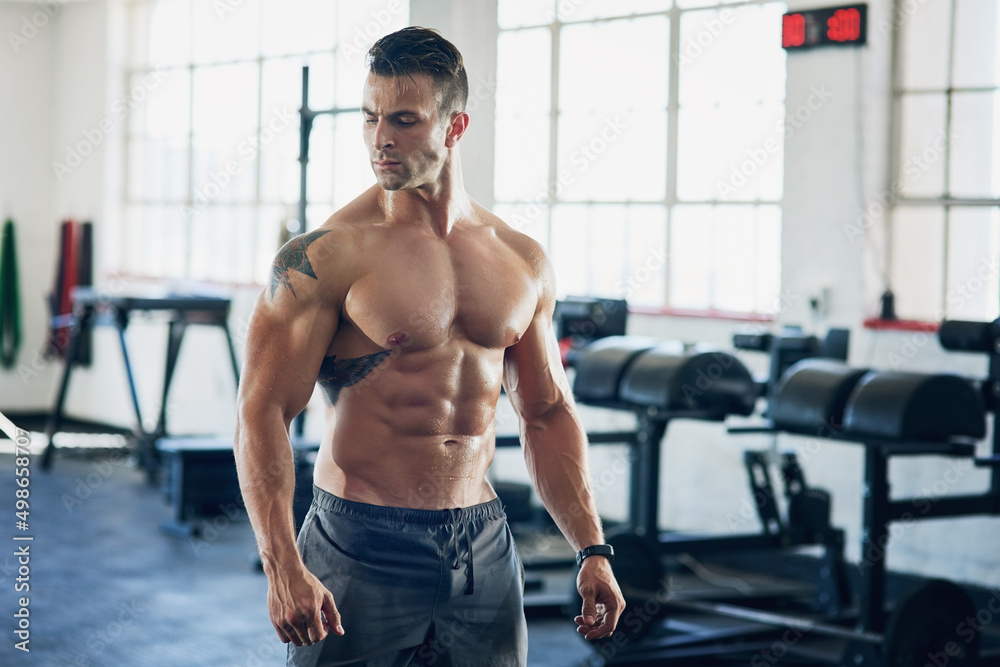 Stand strong, workout to become even stronger. Shot of a handsome young man working out at the gym. Stand strong, workout to become even stronger. Shot of a handsome young man working out at the gym.