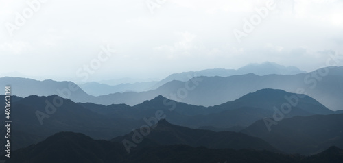 Chinese painting style blue tone ink mountains.