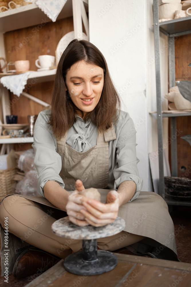 Small handmade pottery business the process of modeling and molding a clay jar in a studio or workshop. Young artist making handmade pottery for sale or leisure as hobby