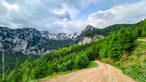 A hiking path with scenic view on mountain peaks of Kamnik Savinja Alps in Carinthia, border Austria and Slovenia. Trail to Velika Baba in Vellacher Kotschna. Mountaineering. Freedom concept. Europe