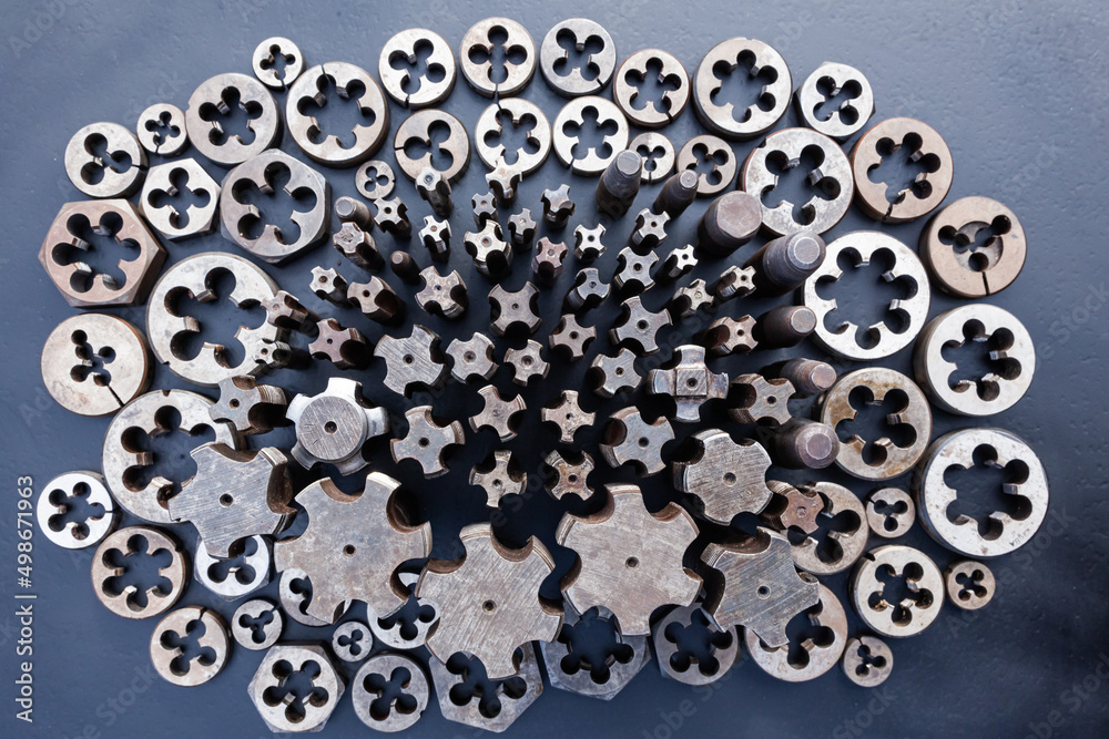 Taps and dies for metal threading. Tools for cutting external and