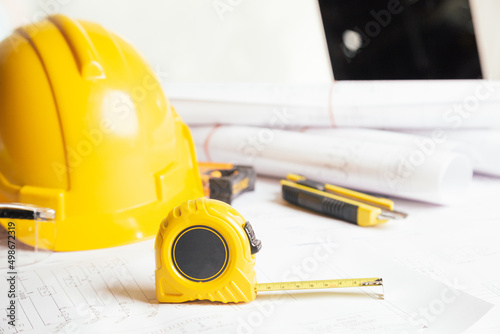 Work safety. Standard Construction site protective equipment on table wooden background, flat lay, copy space,safety first concepts.