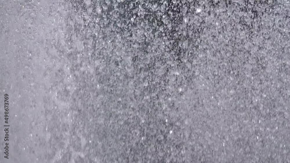 Closeup of water spurting from the fountain. Water jet splashing. 4K Closeup of water spurting from the fountain. Water jet splashing. 4K
