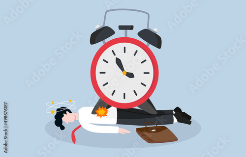 Time management failure, inefficiency to finish project before deadline, too much pressure at work concept. Confused businessman lying on floor while large sized timer clock placing on top of him. photo