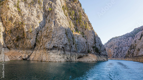 Double water footprints from a boat on the water in Green Canyon in Turkey