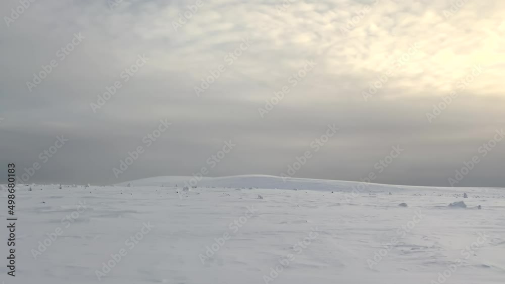 Panorama of the Vologda Gran mountain camp in the Ural mountains. Beautiful winter landscape. Tourist skis with ski poles stand next to the modules. Ski trip. Snow-white fields, hills and mountains. Panorama of the Vologda Gran mountain camp in the Ural mountains. Beautiful winter landscape. Tourist skis with ski poles stand next to the modules. Ski trip. Snow-white fields, hills and mountains.