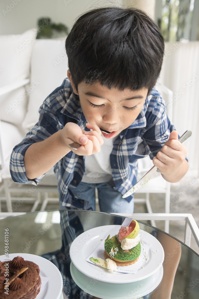 Portrait of child face with messy mouth from eating; Portrait happy Kid with a dirty face eating smoothie; Cute littie boy with yummy face. Portrait of child face with messy mouth from eating; Portrait happy Kid with a dirty face eating smoothie; Cute littie boy with yummy face.