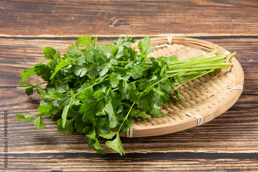 coriander or Chinese parsley on wooden table coriander or Chinese parsley on wooden table