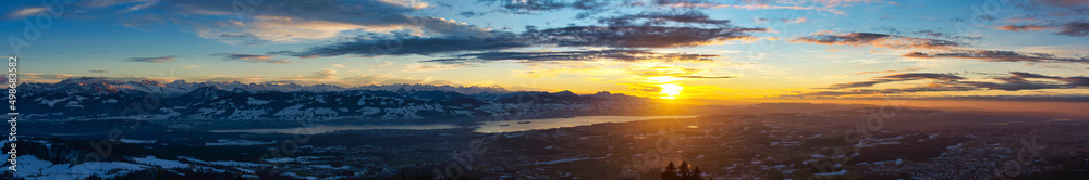 Fototapeta premium Panorama, Top view from Bachtel Tower located at Zurich Oberland during Winter sunset time. view over lake of Zurich