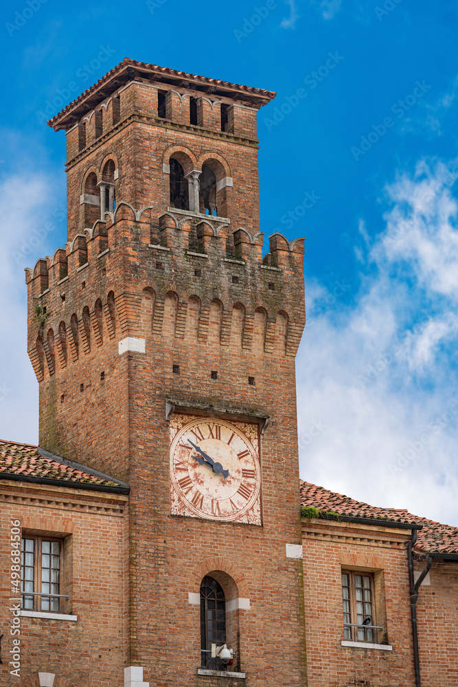 Small town of Oderzo in Treviso province, Veneto, Italy, Europe. Close-up of the medieval clock tower called Torresin, town square called Piazza Grande.