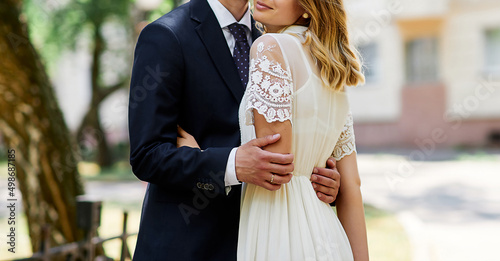 couple at the wedding hugging hands close-up