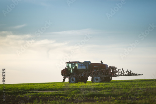self propelled sprayer on agricultural green field