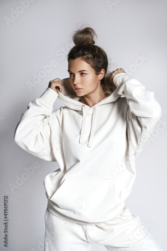 Young woman stylish woman wearing white hoodie