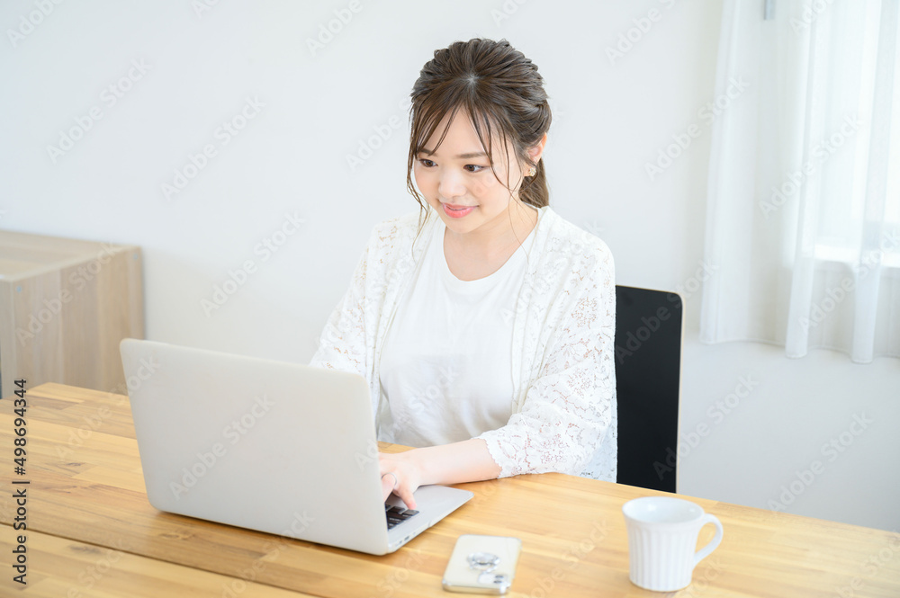 Woman working on computer at home Woman working on computer at home