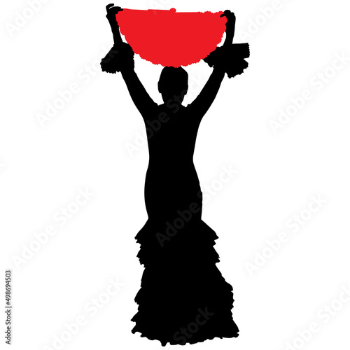 Black silhouette of flamenco dancer in beautiful dress with fan in her hand