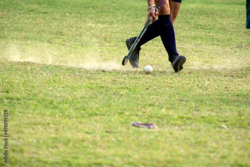 Photography Hockey player going to pick up hockey ball
