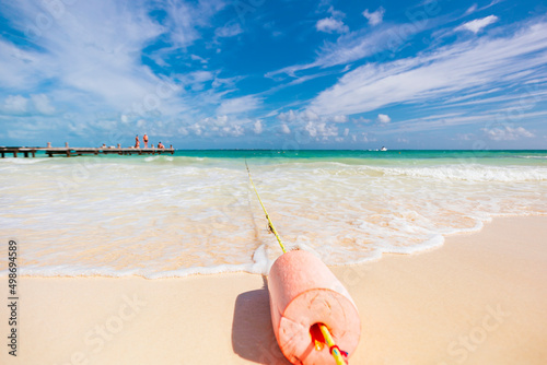 Cancun Mexico beautiful caribbean sea on a sunny day and cloudy sky. sandy beach