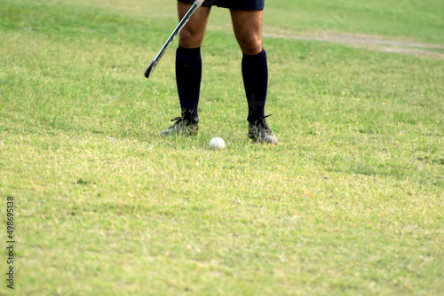 Hockey player going to pick-up ball in a training © suman
