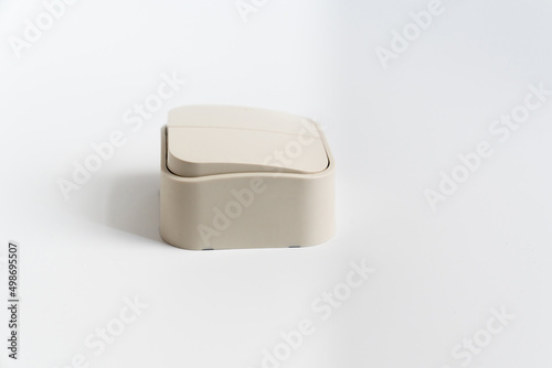 Two-key light switch on a white background. mechanical device for switching the lighting circuit, has two control keys. shop of electronic devices for the home.