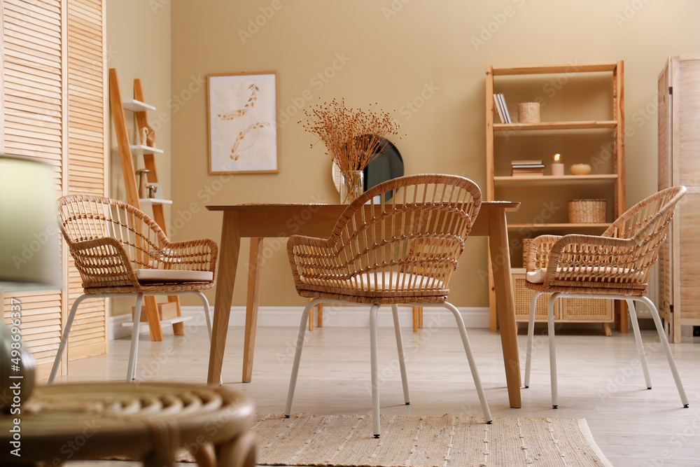 Fototapeta premium Beautiful dining room interior with new stylish furniture